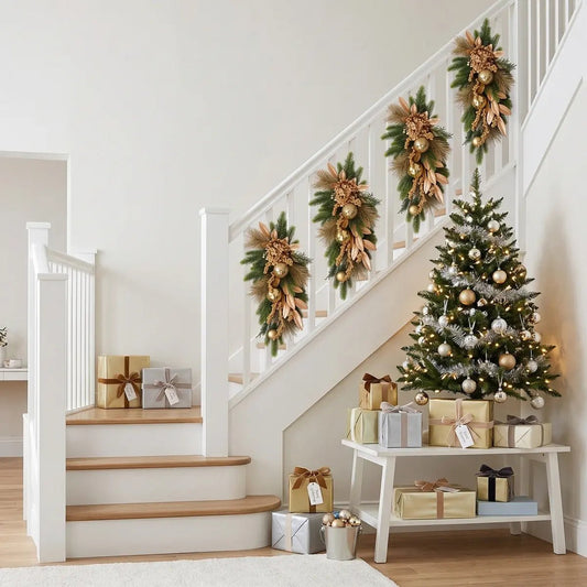 Christmas teardrop swag wreath decorating staircase banister with holiday greenery and gold accents