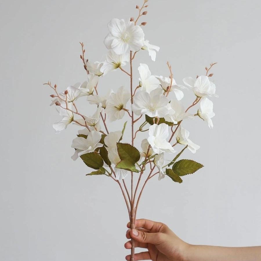 Artificial magnolia blossom stems in pink and white for wedding centerpiece