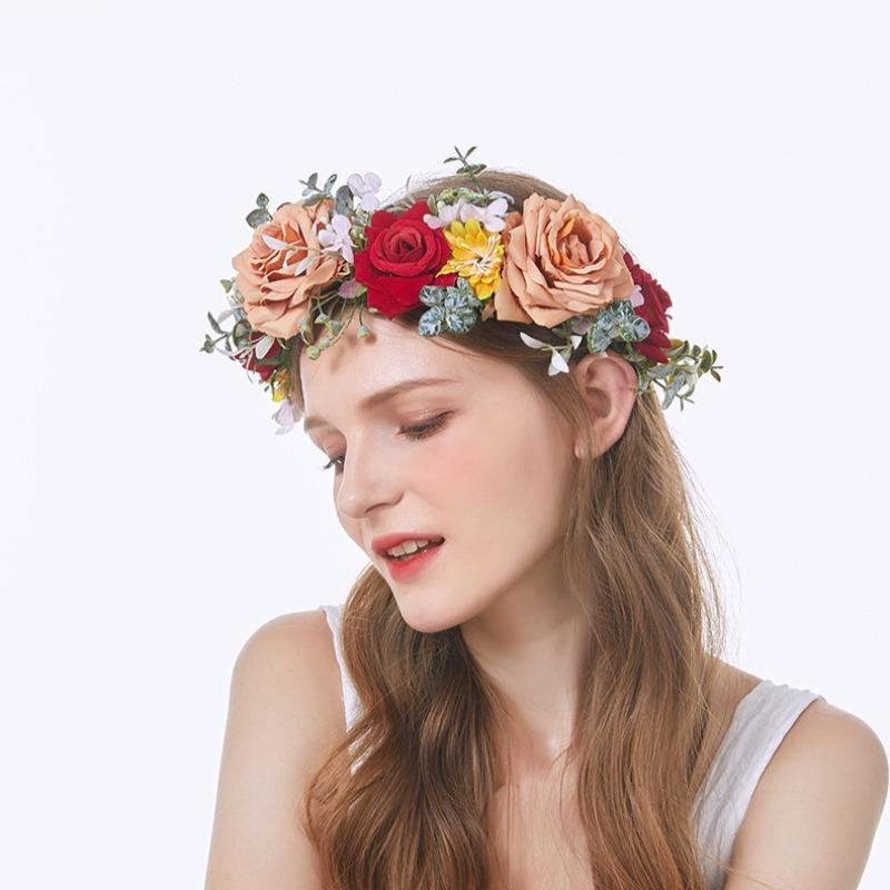 Floral rose hair wreath halo worn as bridal headpiece for wedding ceremony