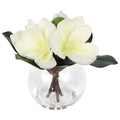 White artificial magnolia flowers in glass vase with faux water for home bathroom office decor