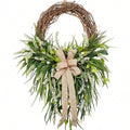 Farmhouse front door wreath with burlap bow green foliage and white flowers for spring summer rustic home porch and wall decor