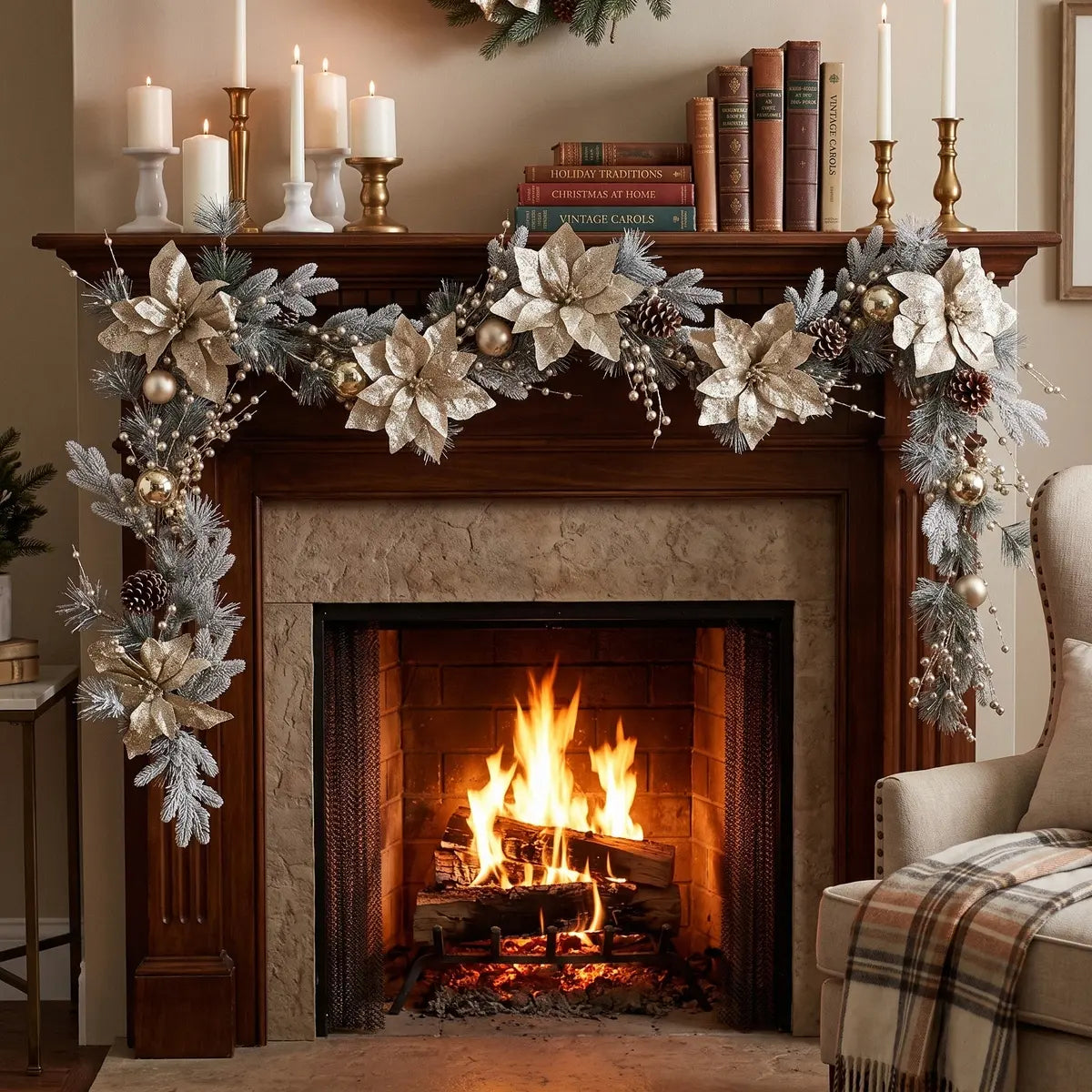5.9FT Christmas garland with large champagne glitter poinsettia blooms, gold ball ornaments, pine cones and silver berry sprays, draped across a dark wood fireplace mantel with white pillar candles, gold candlesticks and holiday books beside a roaring fire
