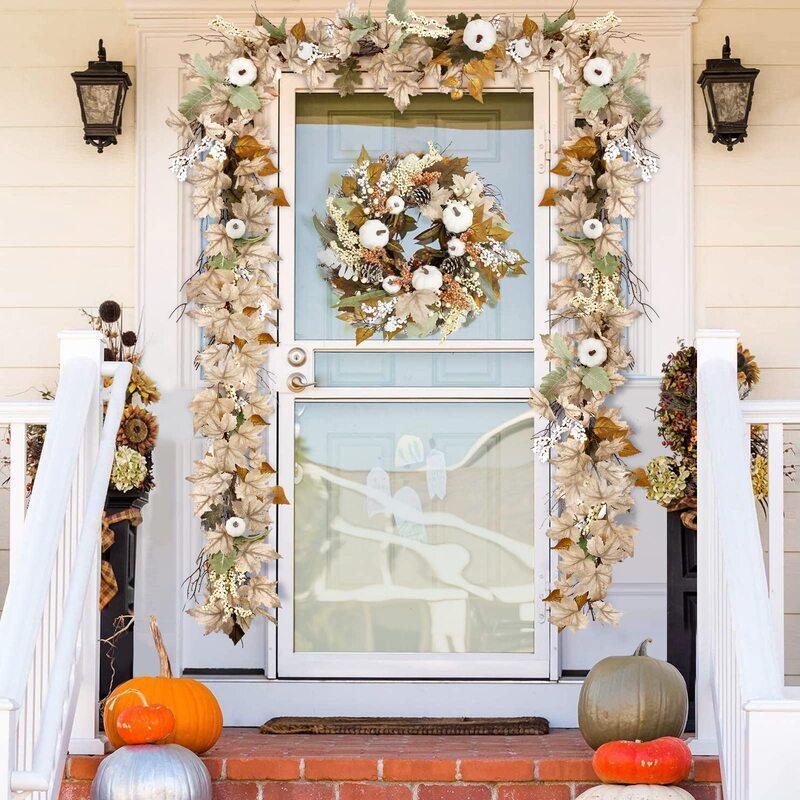 Artificial autumn garland with orange maple leaves and mini pumpkins