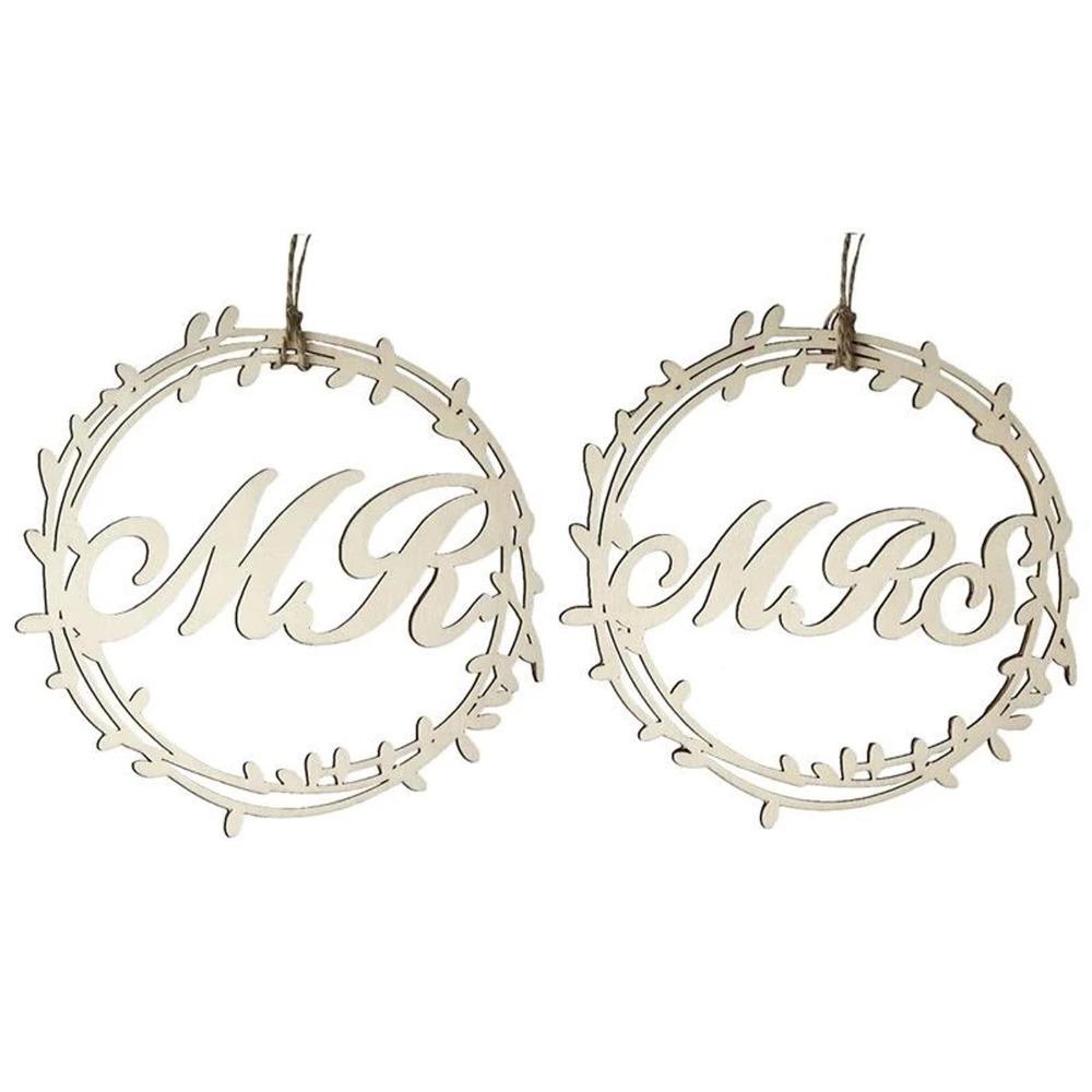 Close-up of Mr and Mrs wooden sign with rustic rope hanger for wedding