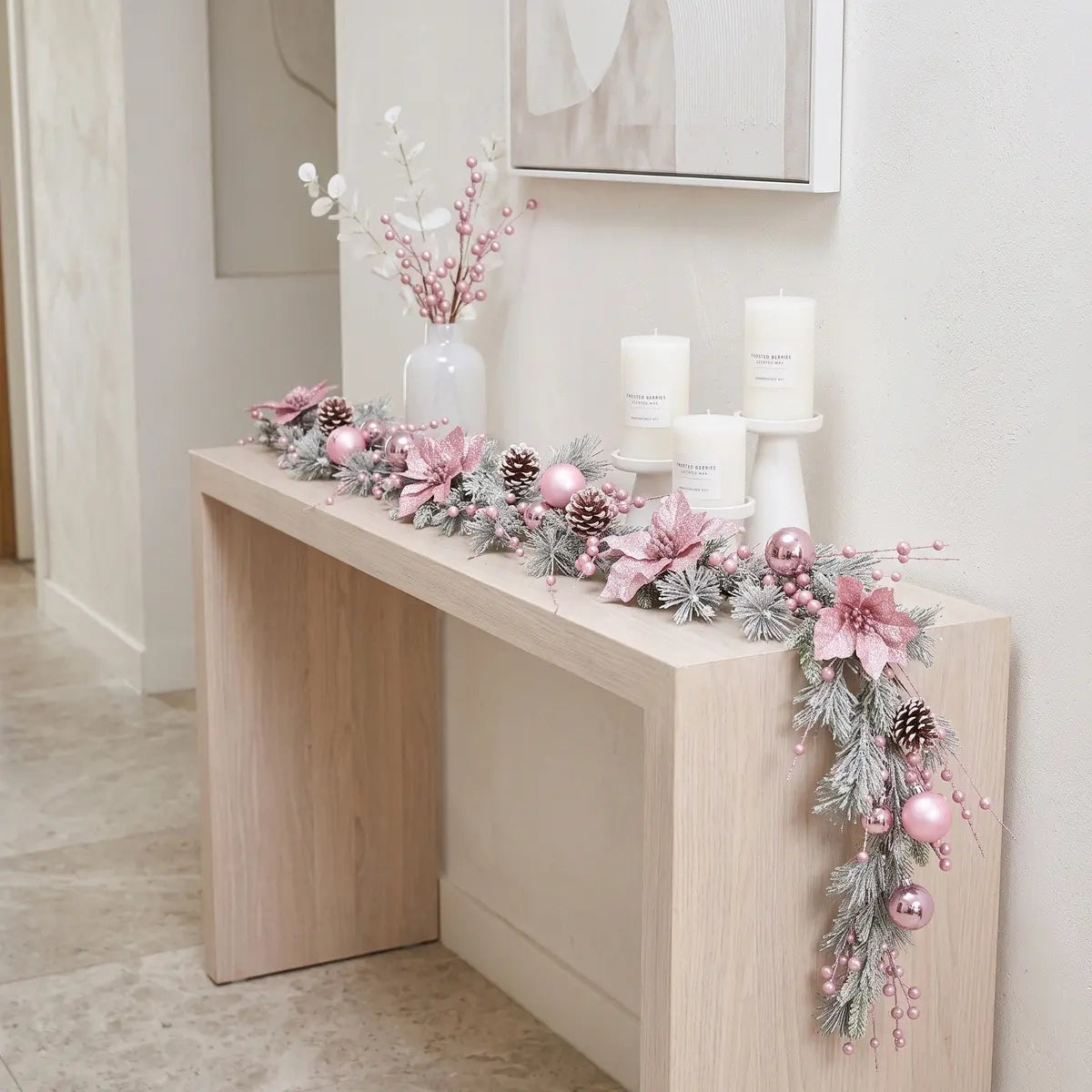 Pink Artificial Christmas Garland Draped on Fireplace Mantel with Stockings
