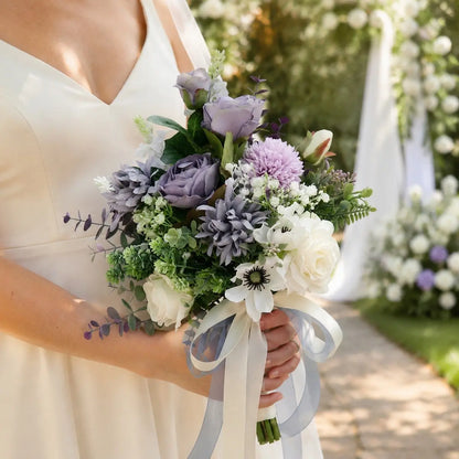 Bride holding artificial dusty purple rose chrysanthemum white anemone bridal bouquet with satin ribbon at outdoor garden wedding – IPOPU
