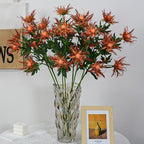 Faux eryngium thistle stems arranged in bouquet – artificial blue flowers for decor