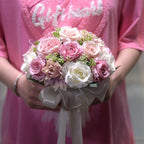 Artificial rose bouquet held by bride for wedding and prom photos