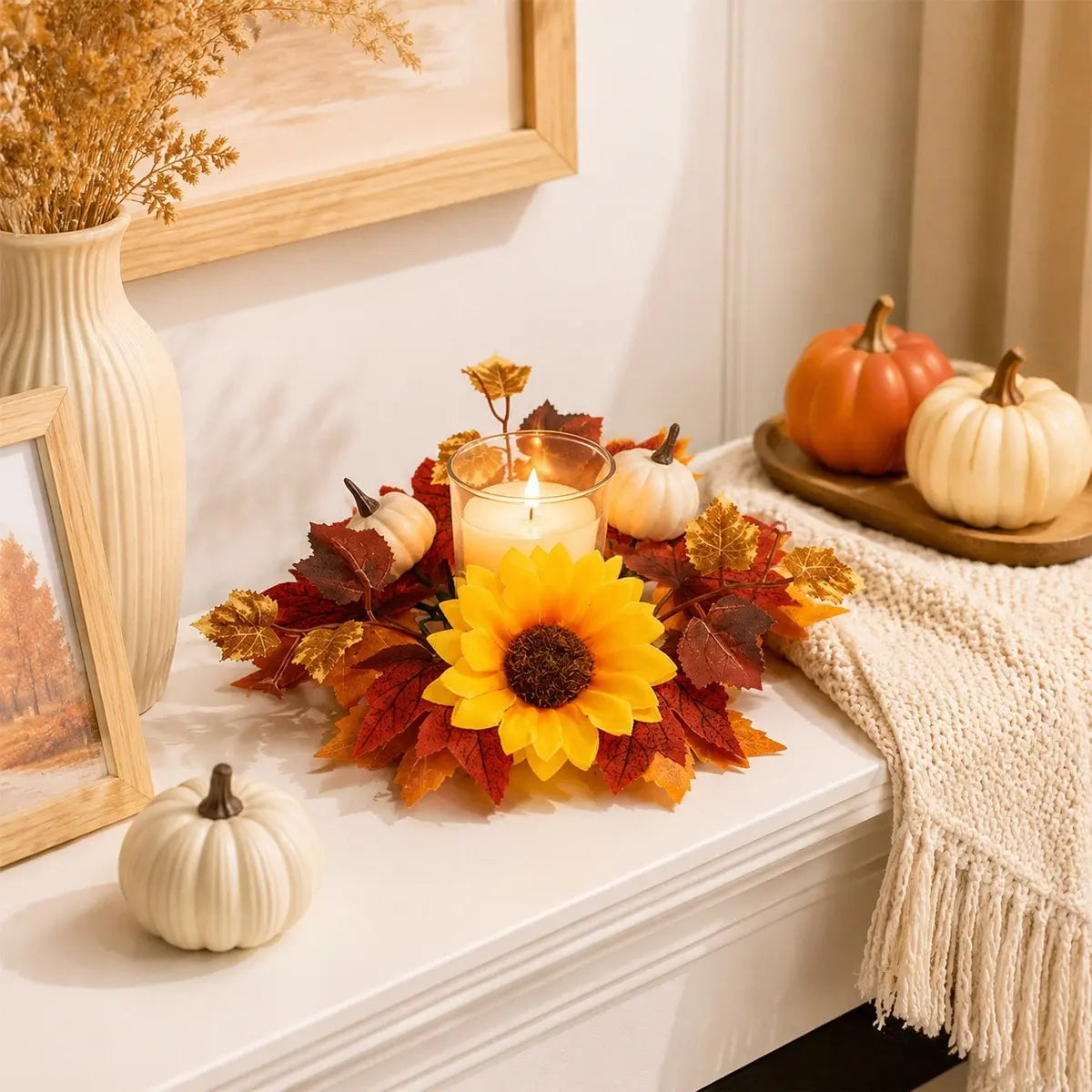 Fall candle ring wreath with sunflower and gradient maple leaves arranged around a candle on a dining table with autumn home decor