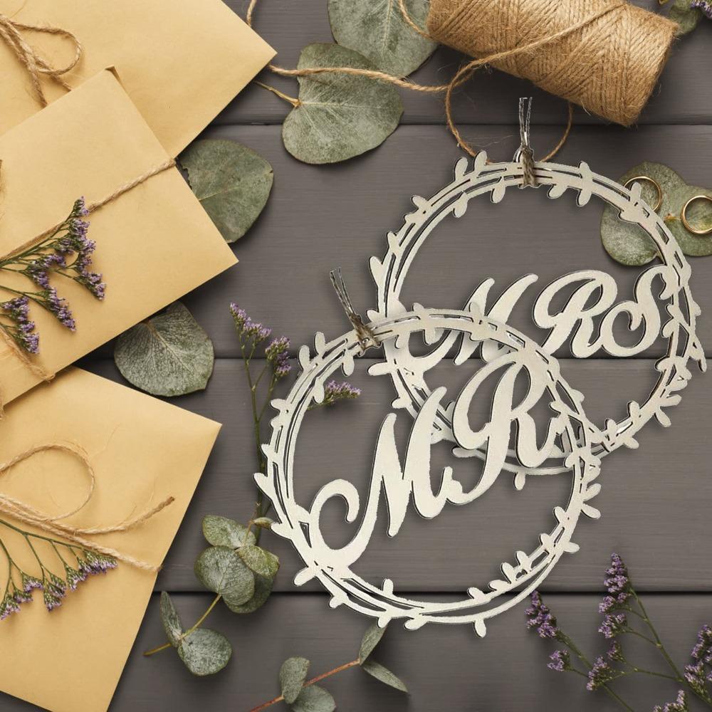 Wedding chair signs Mr and Mrs used as photo props at ceremony
