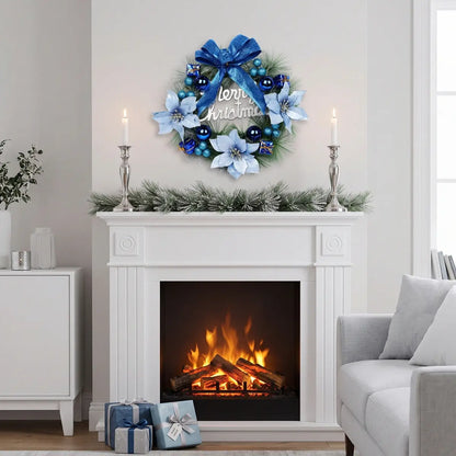 Artificial pine Christmas wreath with blue bow and white poinsettias displayed above a white fireplace in a cozy living room holiday setting
