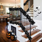 Close-up of black artificial maple leaf details on Halloween vine garland