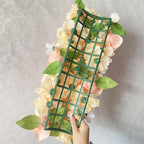 Close-up of lifelike floral swags for wedding arch party by IPOPU