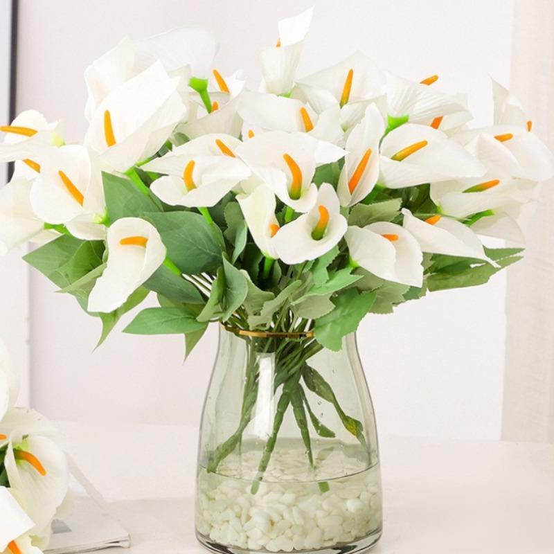 Close-up of faux calla lily bloom in artificial bouquet for wedding styling
