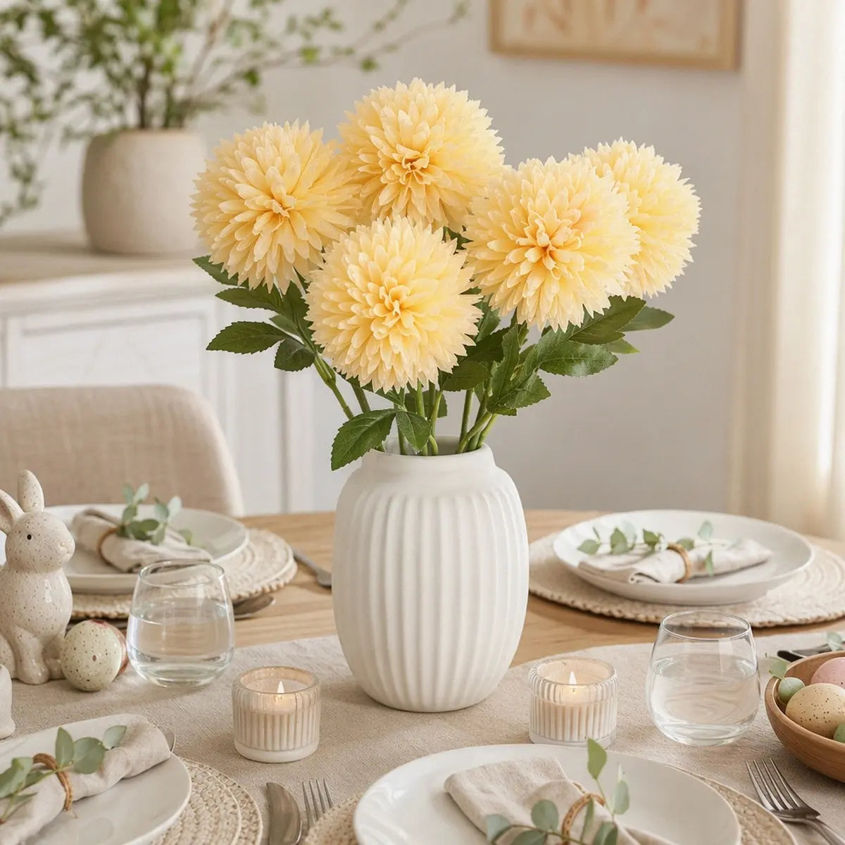 Yellow ball chrysanthemum artificial flowers in white ribbed vase as spring dining table centerpiece with Easter décor