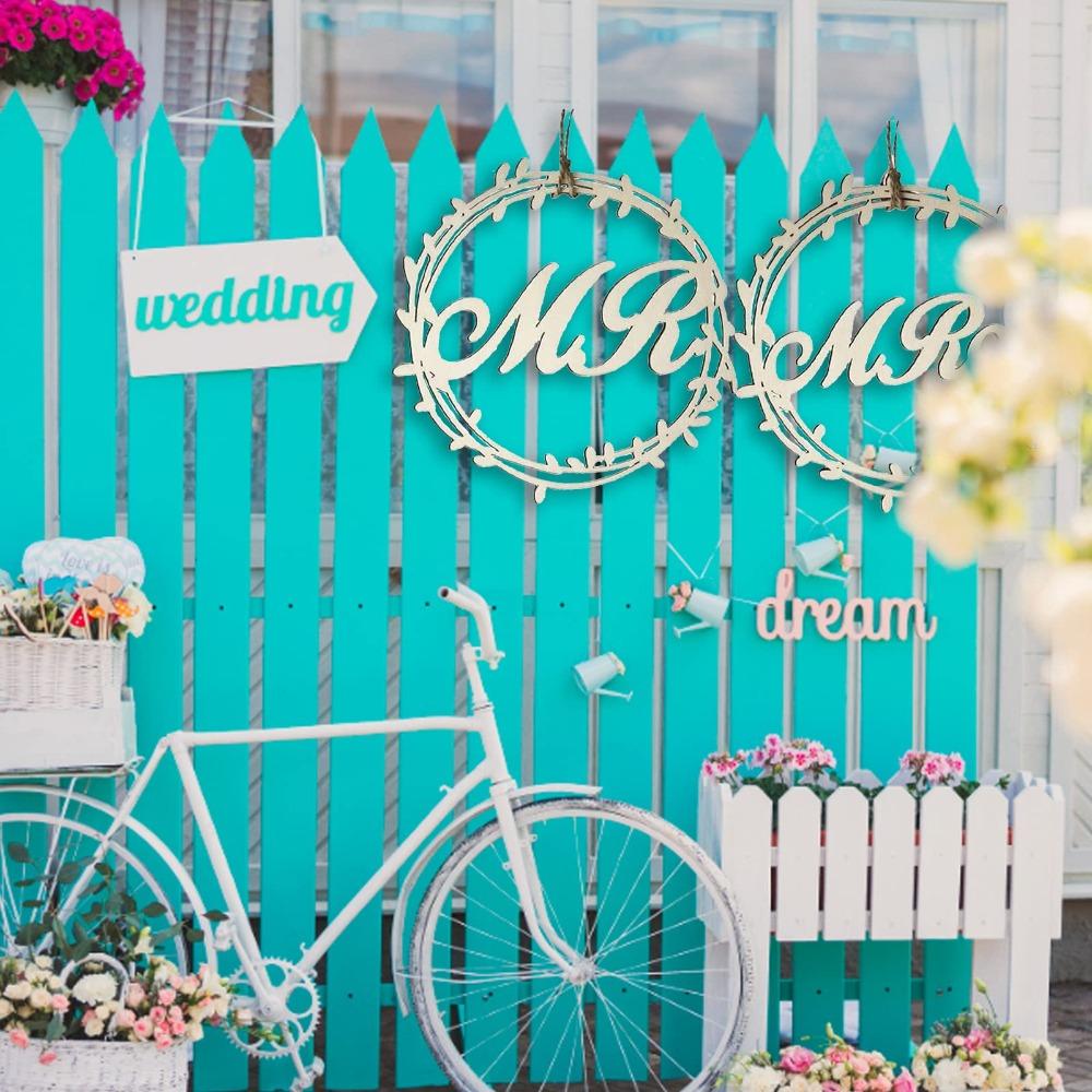 Rustic wooden hanging signs for bride and groom chairs at wedding reception