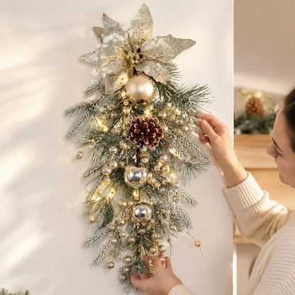 Artificial Christmas Swag Wreath with Champagne Gold Poinsettia and Pine Cones – Held Display
