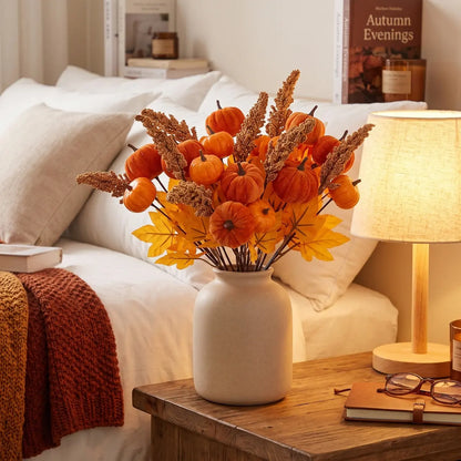 6PCS artificial autumn pumpkin berry maple stem picks arranged in a white ceramic vase on a rustic wooden bedside table with a warm table lamp, glasses, journal, and rust-colored knit throw for cozy fall bedroom decor