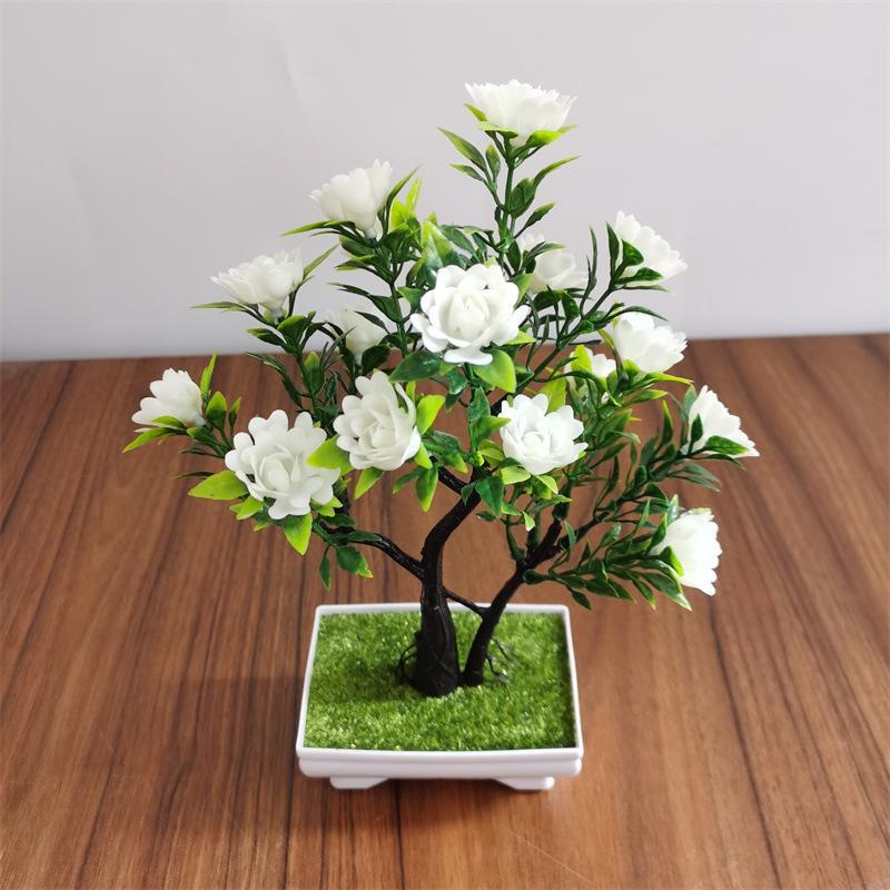 Faux pine bonsai tree detail – artificial pine branches with decorative ceramic pot