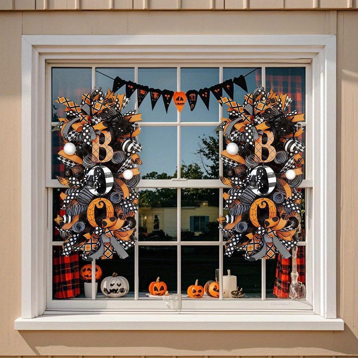 Black Halloween wreath with white pumpkins and skull for outdoor decoration