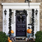 Halloween black maple leaf garland draped over fireplace mantel decoration