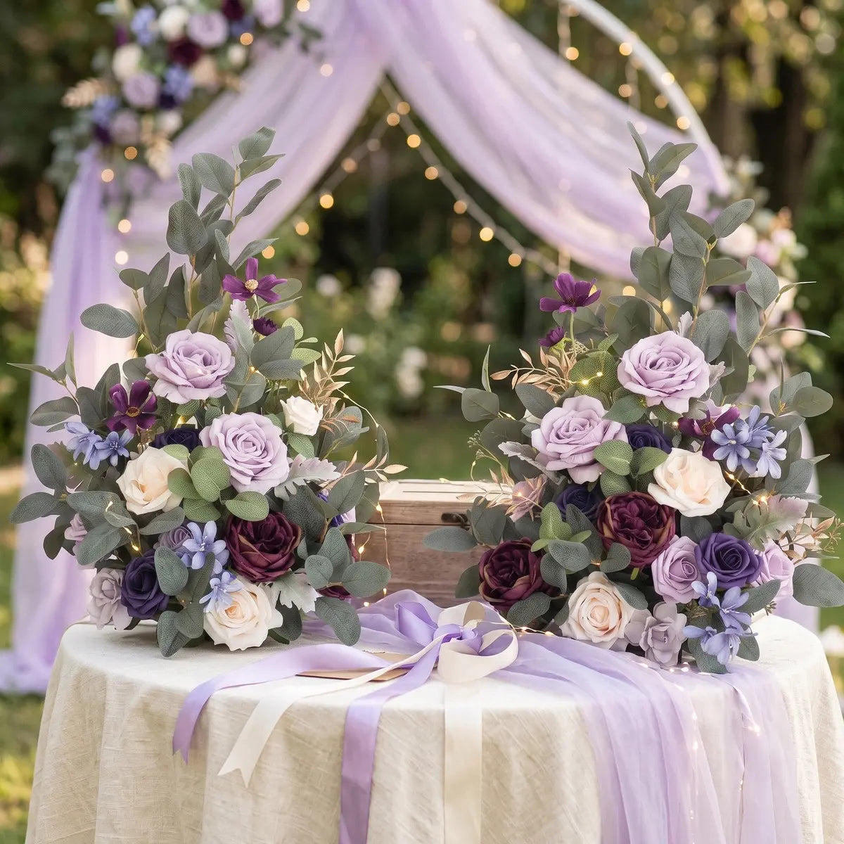 Artificial purple lavender rose centerpiece pair on outdoor wedding sign-in table with fairy lights and lavender ribbon – IPOPU
