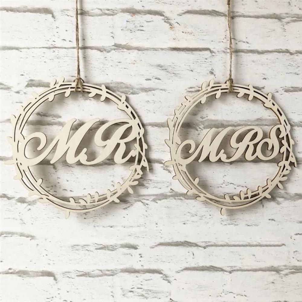 Hanging wooden wedding signs for Mr and Mrs chairs at ceremony and reception