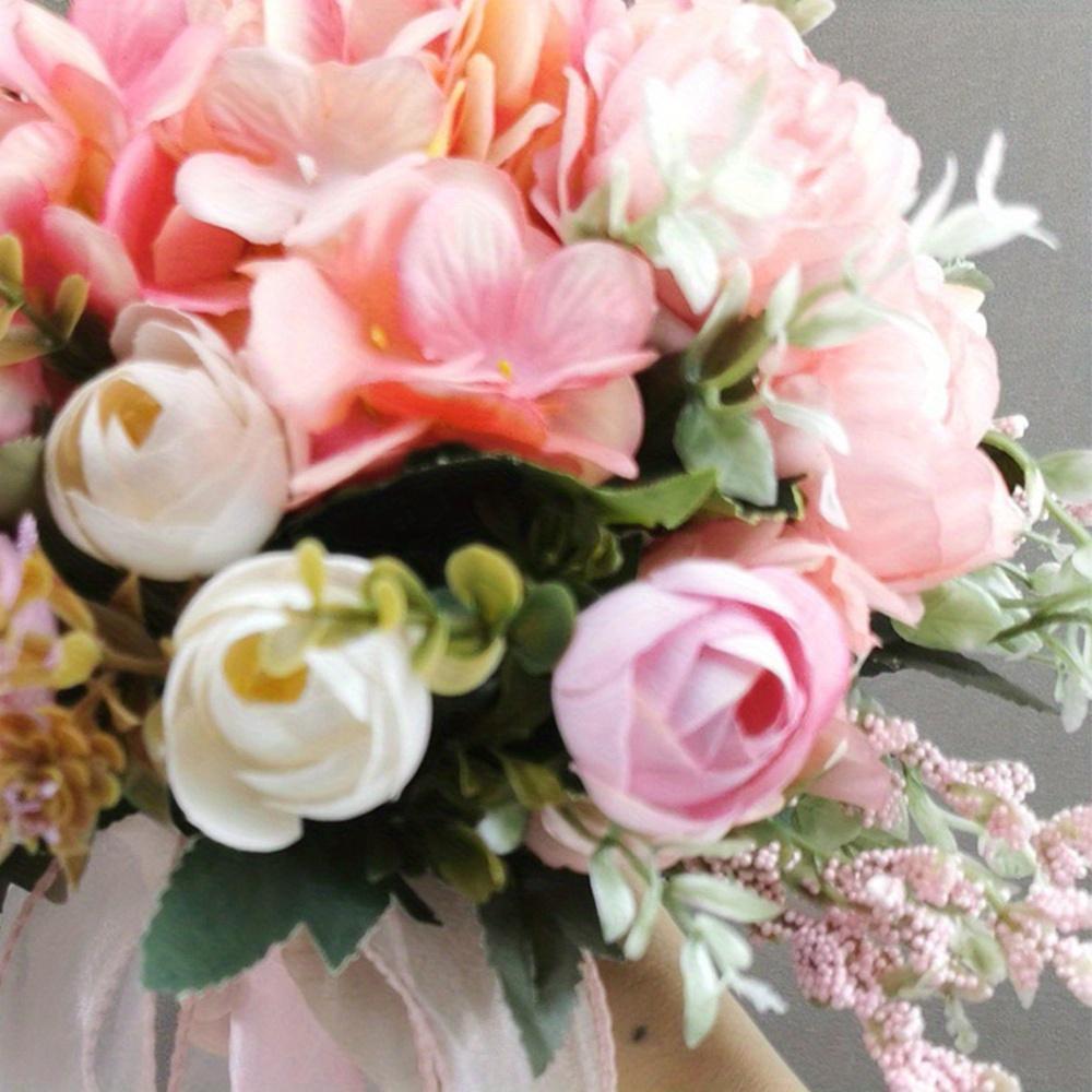 Close-up of faux rose and hydrangea blooms in artificial bridal bouquet