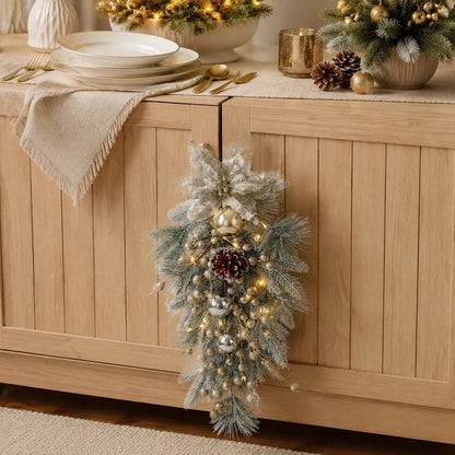 Ivory and Gold Artificial Christmas Swag Wreath Decorating a Sideboard

