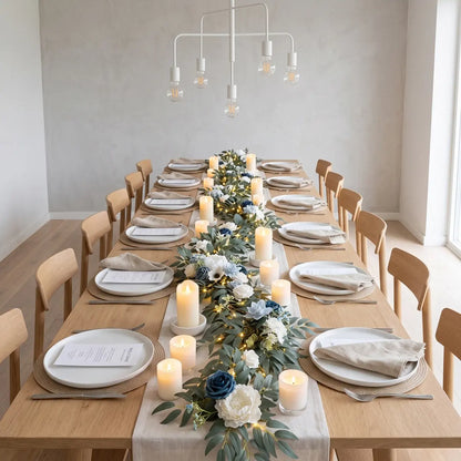 Artificial dusty blue navy white rose eucalyptus garland with LED lights as table runner on long wood dining table with pillar candles and place settings – IPOPU