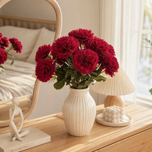 3pcs artificial red carnation flowers in white ribbed vase on bedroom dresser, elegant home décor with mirror and lamp