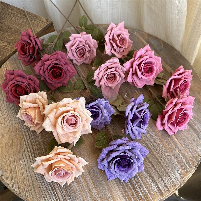 Big faux rose branch in warm tones for vintage wedding decoration