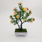 Artificial pine bonsai in decorative pot on office desk – faux welcoming pine plant