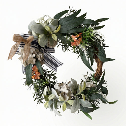 Modern farmhouse front door wreath with hydrangea blooms black and white striped bow and green leaves for fall winter home porch and wall decor