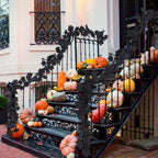 Black maple leaf garland vine draped on staircase for Halloween gothic decor