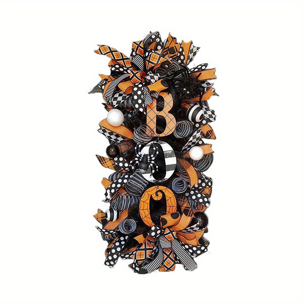 Black white Halloween wreath with pumpkin and skull sign for seasonal decor