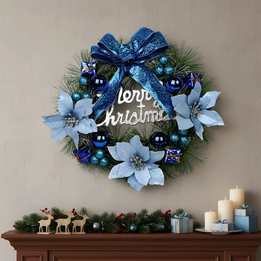 Blue and white Christmas wreath with glitter bow, light blue poinsettias and navy ball ornaments, hung above a fireplace mantel with holiday decor