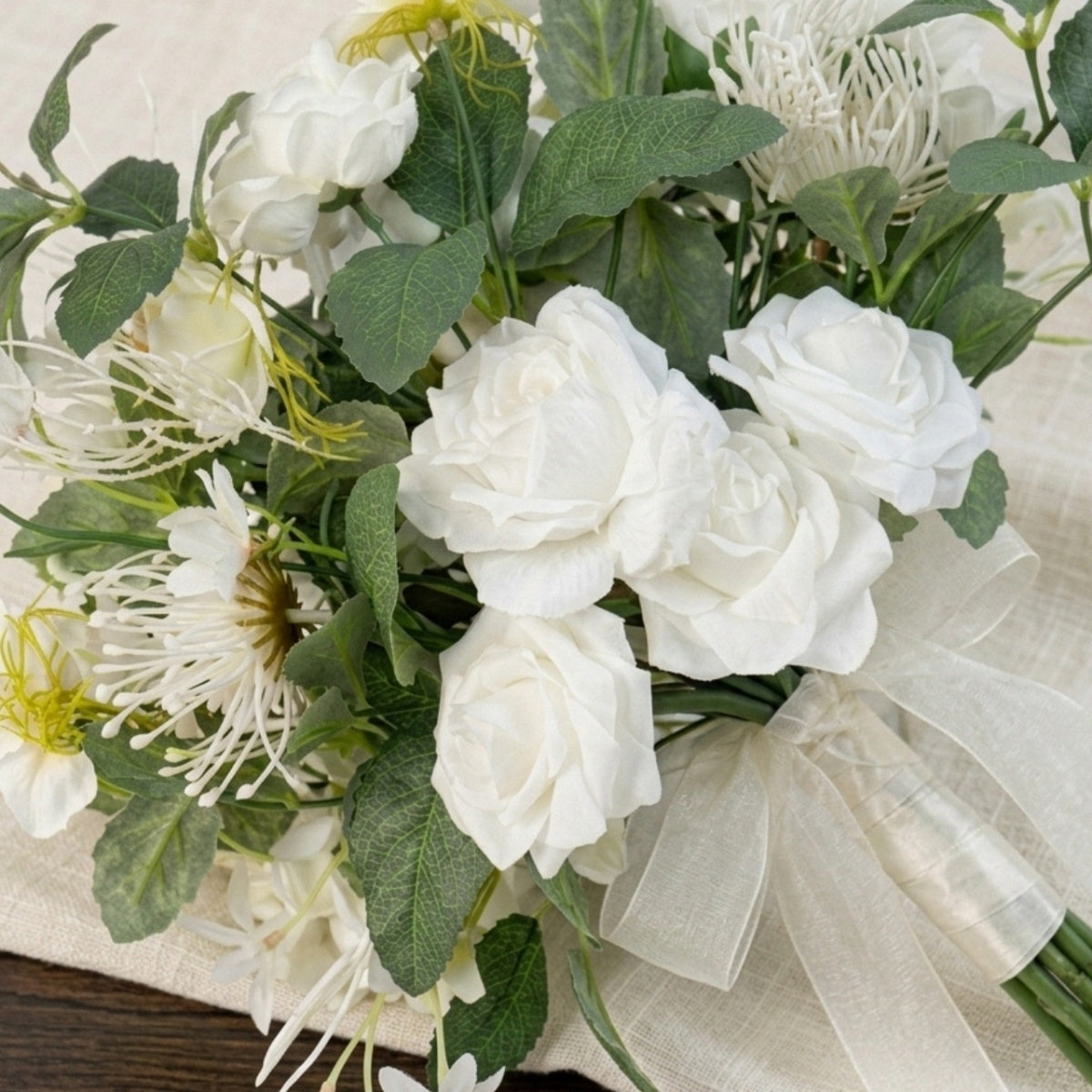 Fake flower bridal bouquet with white roses and greenery for wedding