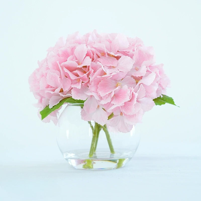 Pink artificial hydrangea flowers in glass vase for home dining table office decor centerpiece