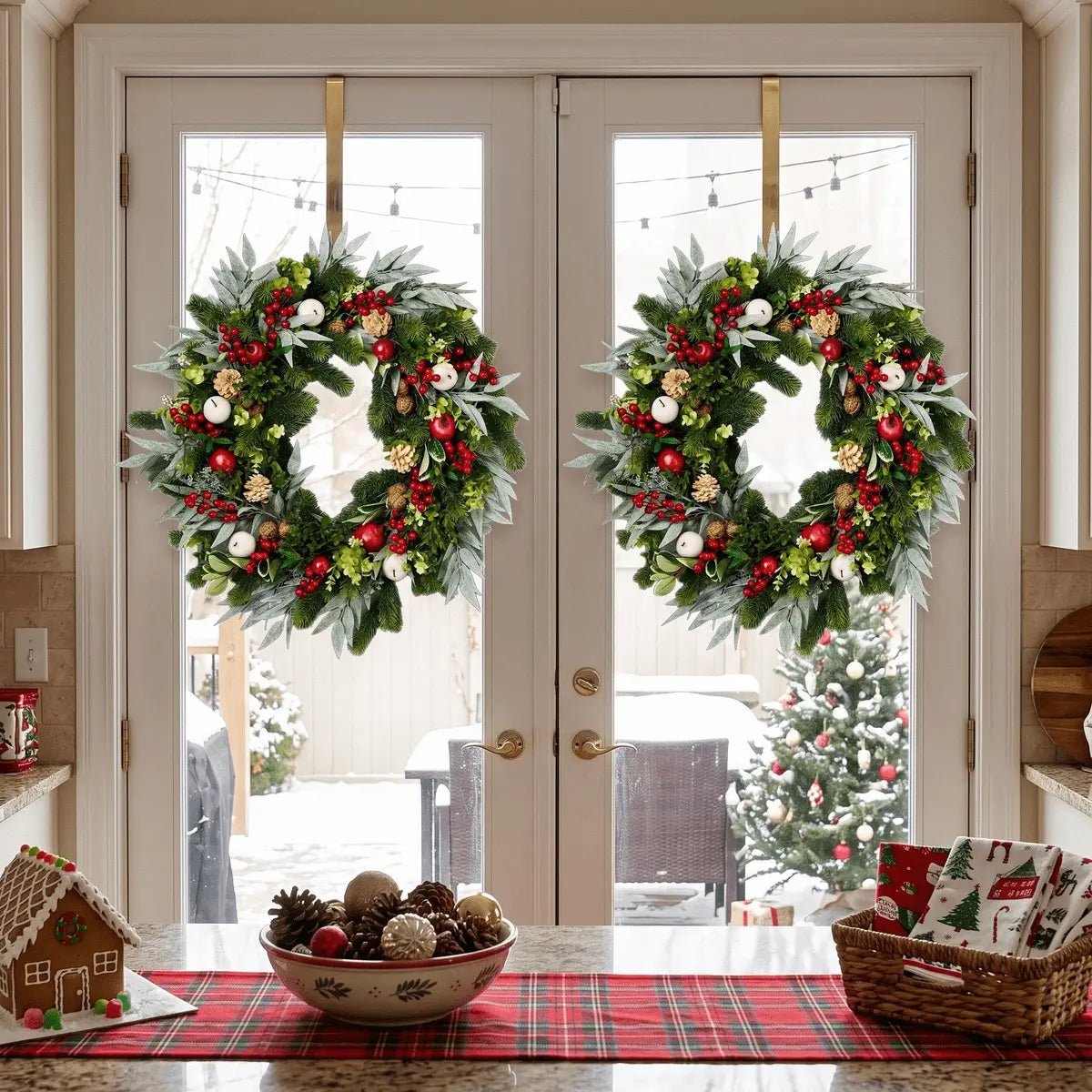 Mixed greenery Christmas wreaths displayed on double doors