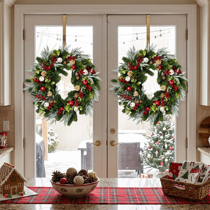 Mixed greenery Christmas wreaths displayed on double doors