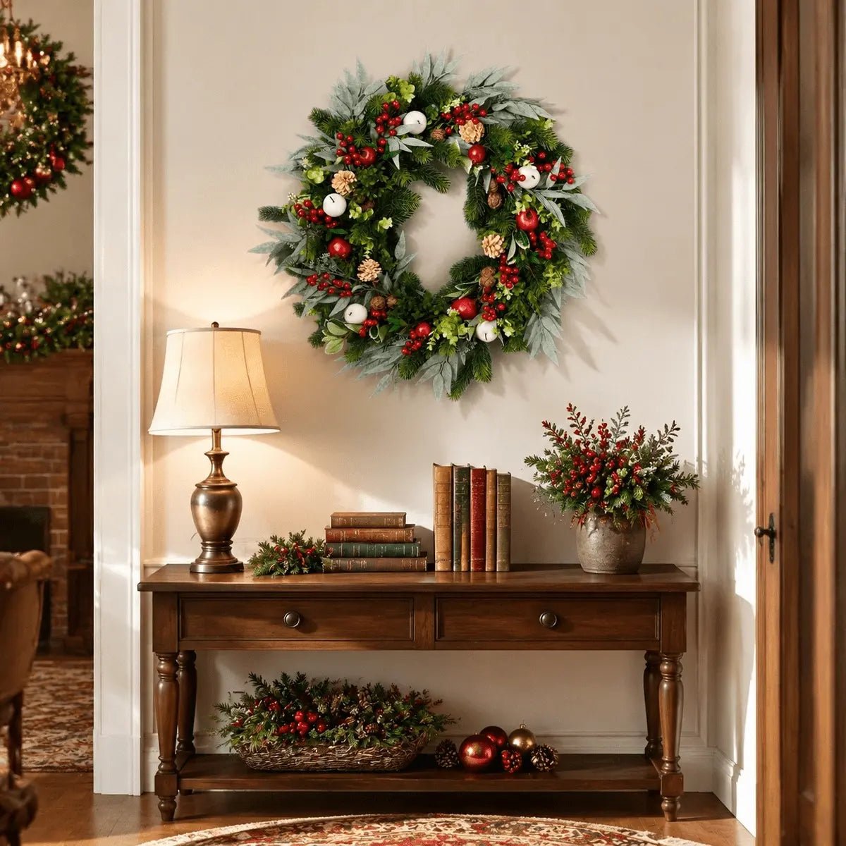 Mixed greenery Christmas wreath displayed above an entryway console