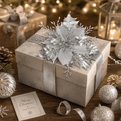 Silver poinsettia pick decorating a wrapped holiday gift