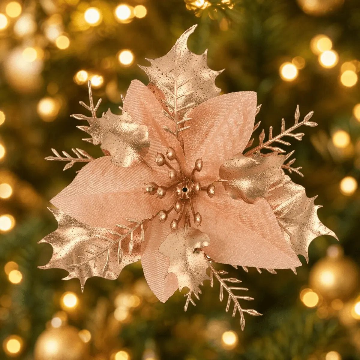 Gold poinsettia pick displayed on a lit Christmas tree