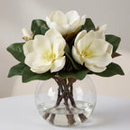 White artificial magnolia flowers in glass vase with faux water for home bathroom office decor