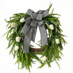 Modern front door wreath with white tulips black and white striped bow and green foliage for spring summer farmhouse home porch and wall decor
