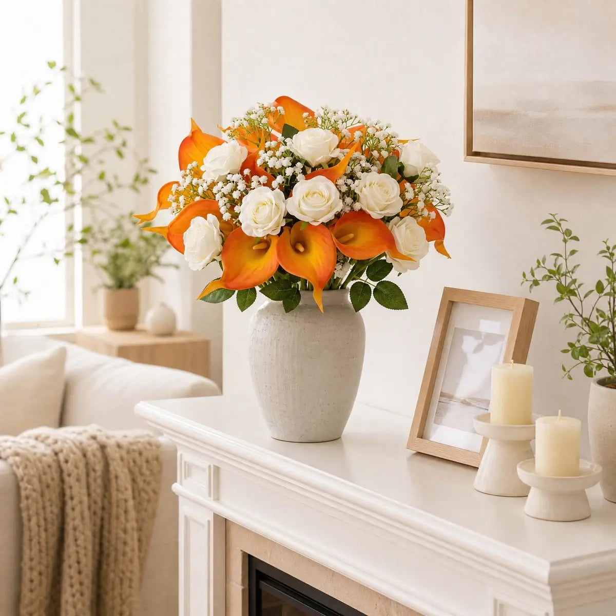 Autumn bouquet with orange calla lilies and white roses displayed as dining table centerpiece