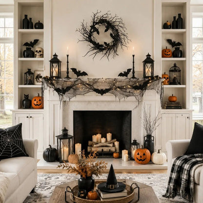 18in black bat twig wreath displayed on wall above fireplace with Halloween candles and gothic home decor
