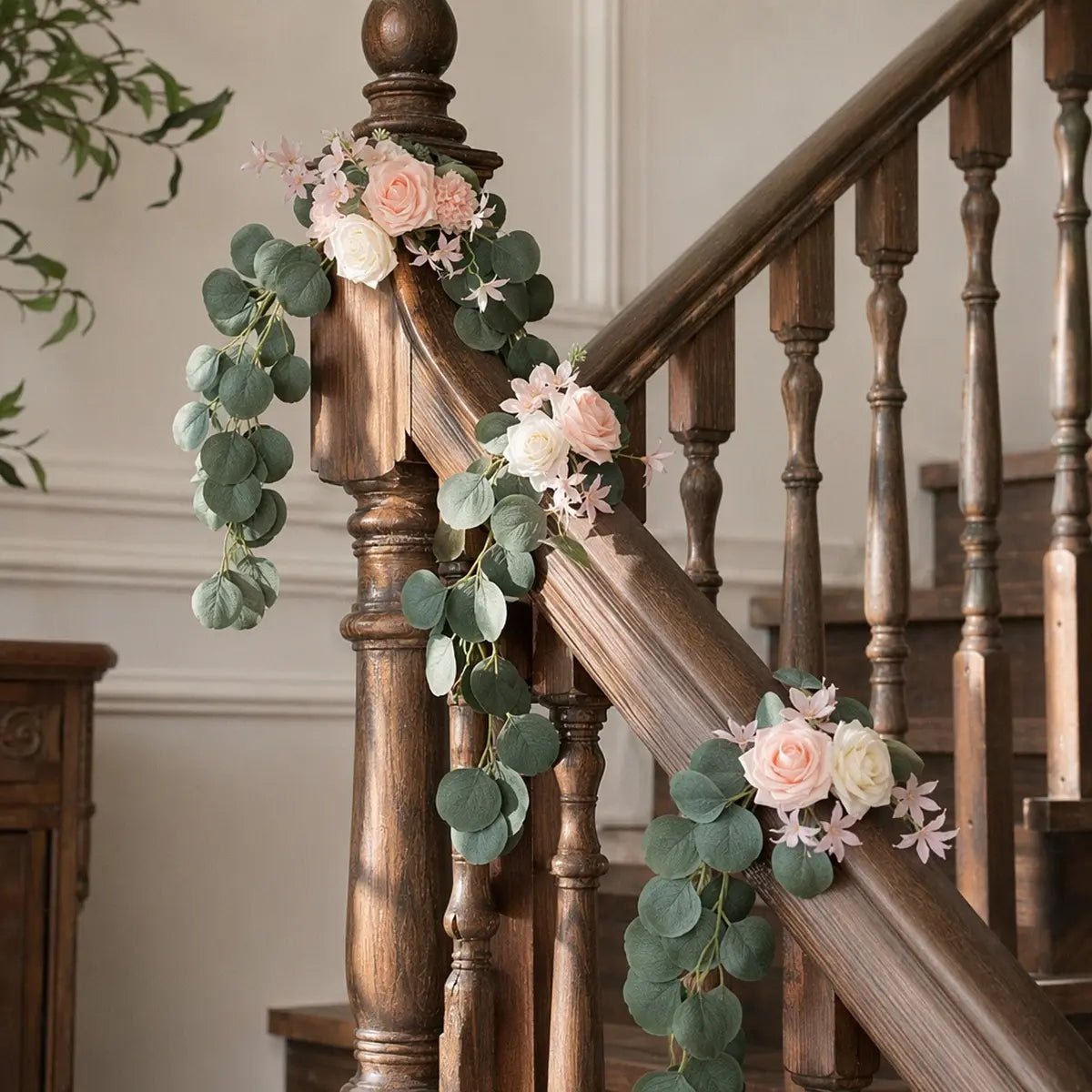 Blush pink rose silver dollar eucalyptus swag set of 2 styled along dark wood staircase banister at three anchor points draping naturally indoors – IPOPU