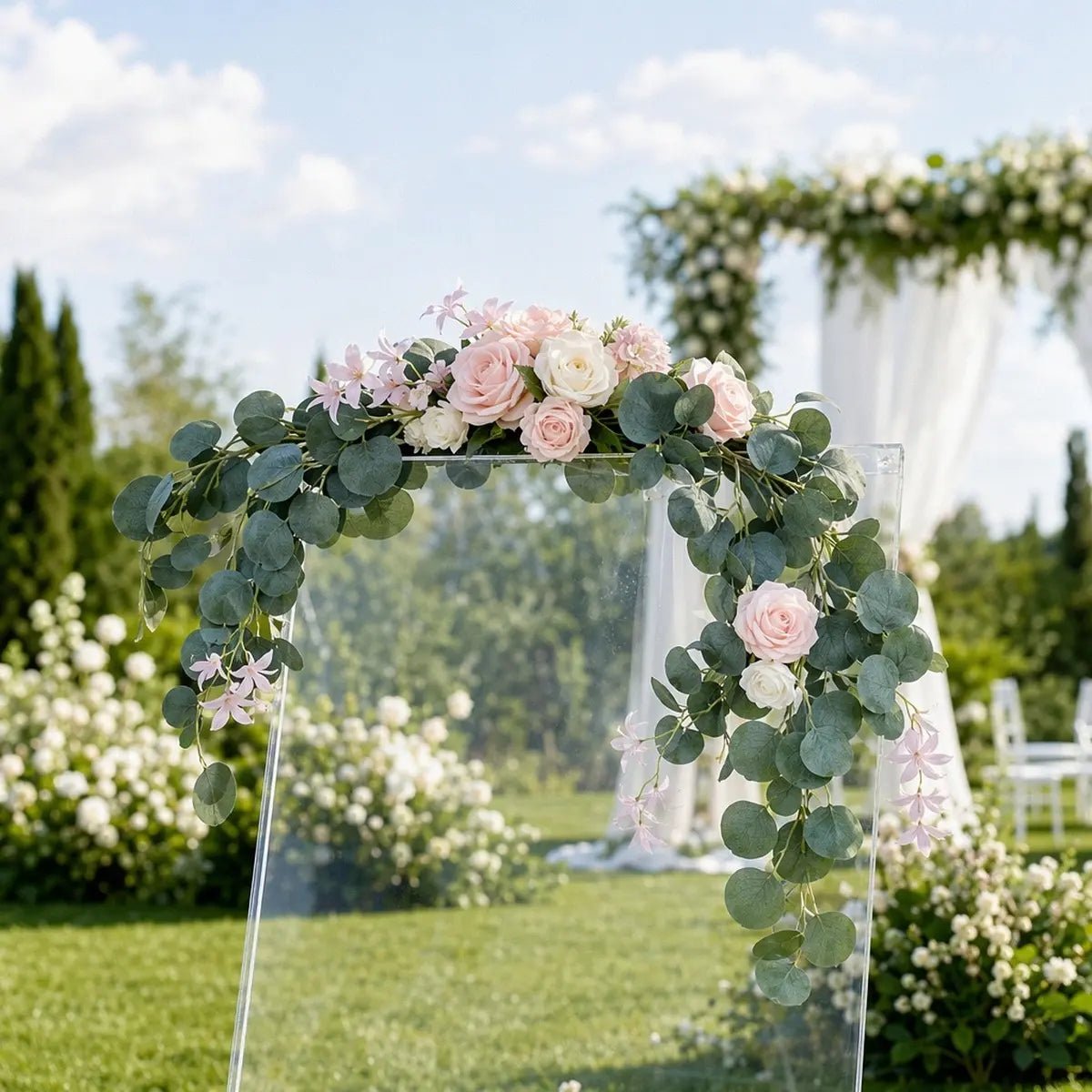 Blush pink rose silver dollar eucalyptus swag set of 2 attached to clear acrylic square wedding arch top and lower corner at outdoor garden ceremony – IPOPU